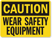 Caution Wear Safety Equipment Sign